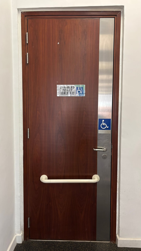 Disabled toilet inside CSE Active with a ramp and automatic doors suitable for wheelchair access